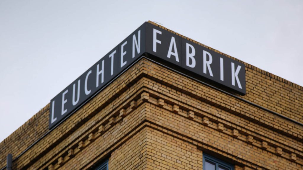 <p>The large illuminated sign at the headquarters of the Leuchtenfabrik in Berlin.</p>